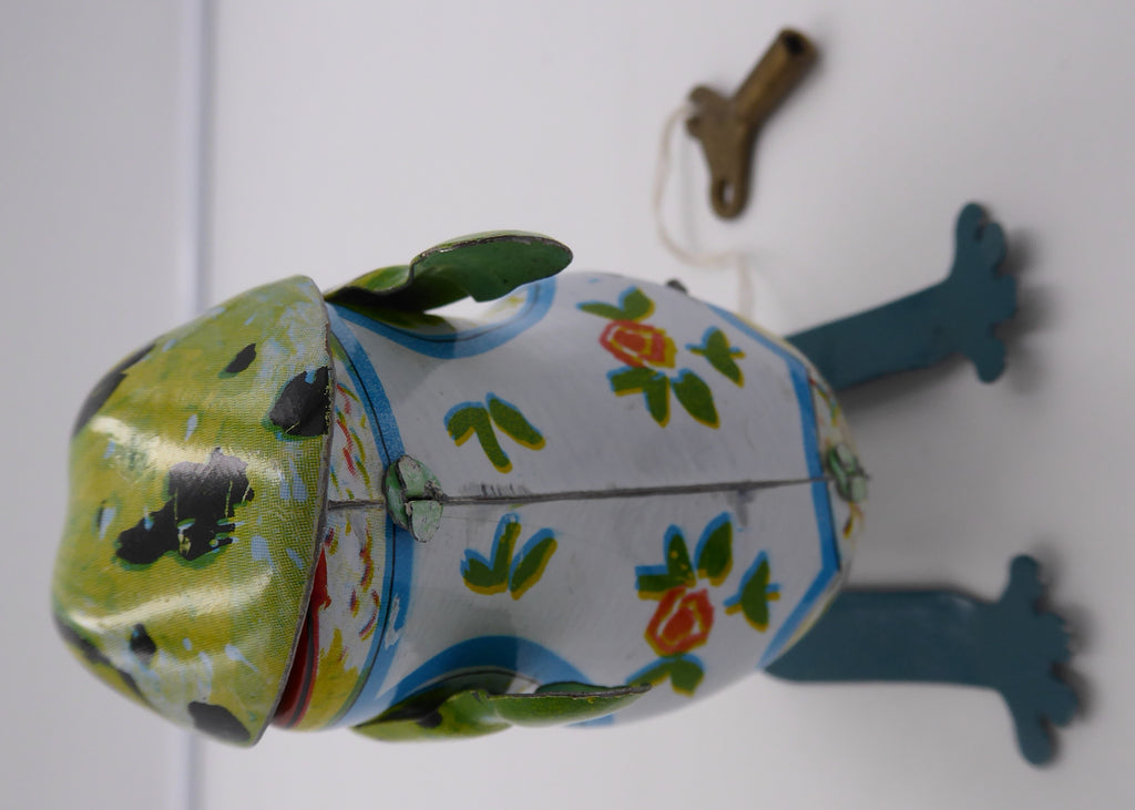 Ancienne grenouille sauteuse en tôle peinte fonctionnant