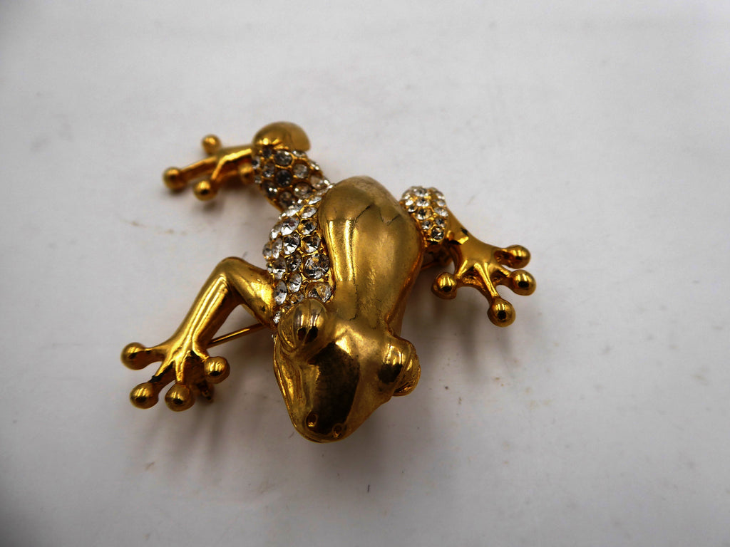 Belle broche en laiton poli et strass