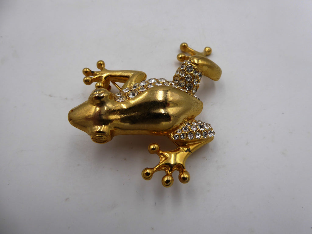 Belle broche en laiton poli et strass