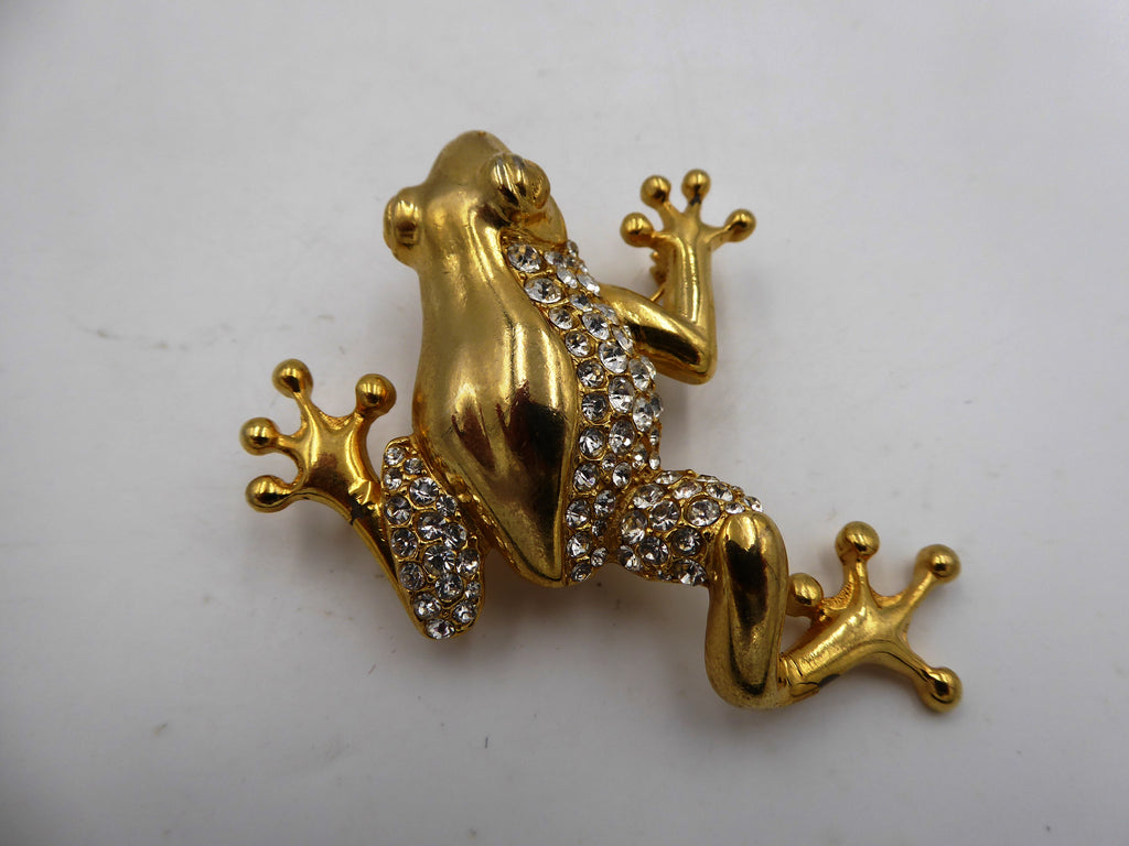 Belle broche en laiton poli et strass