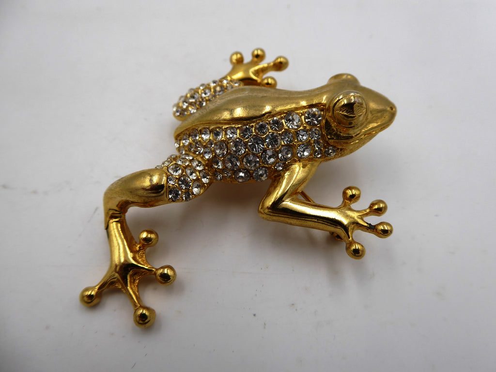 Belle broche en laiton poli et strass