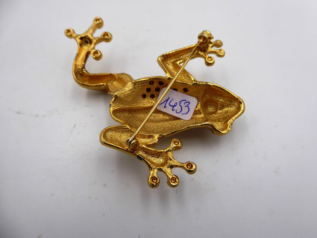 Belle broche en laiton poli et strass