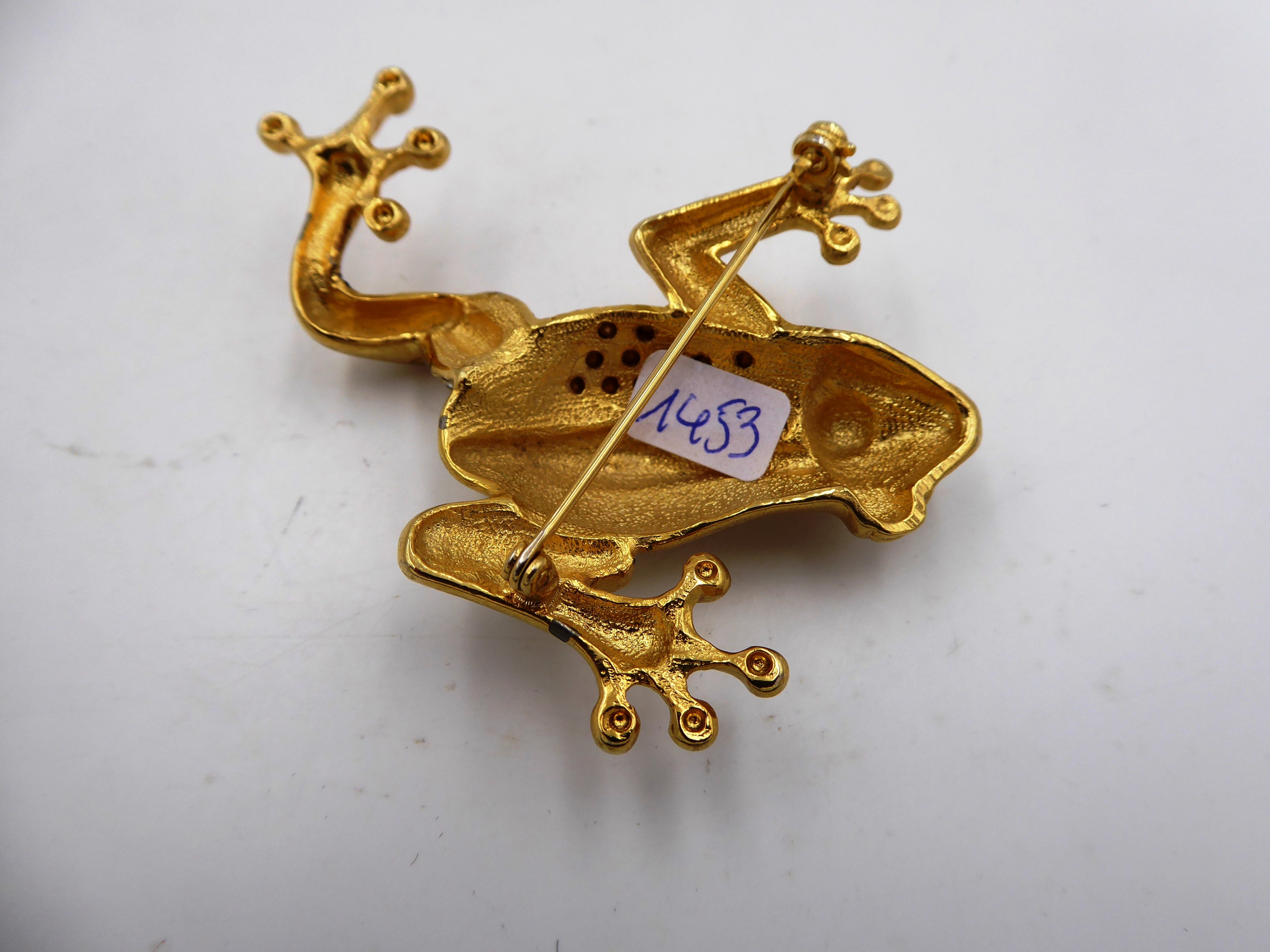 Belle broche en laiton poli et strass