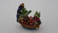 Famille grenouille sur bateau