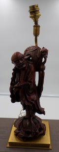 Statuette en bois sculpté représentant le magot LIU HAI accompagné de son crapaud de céleste