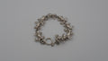 Bracelet en argent comportant huit grenouilles