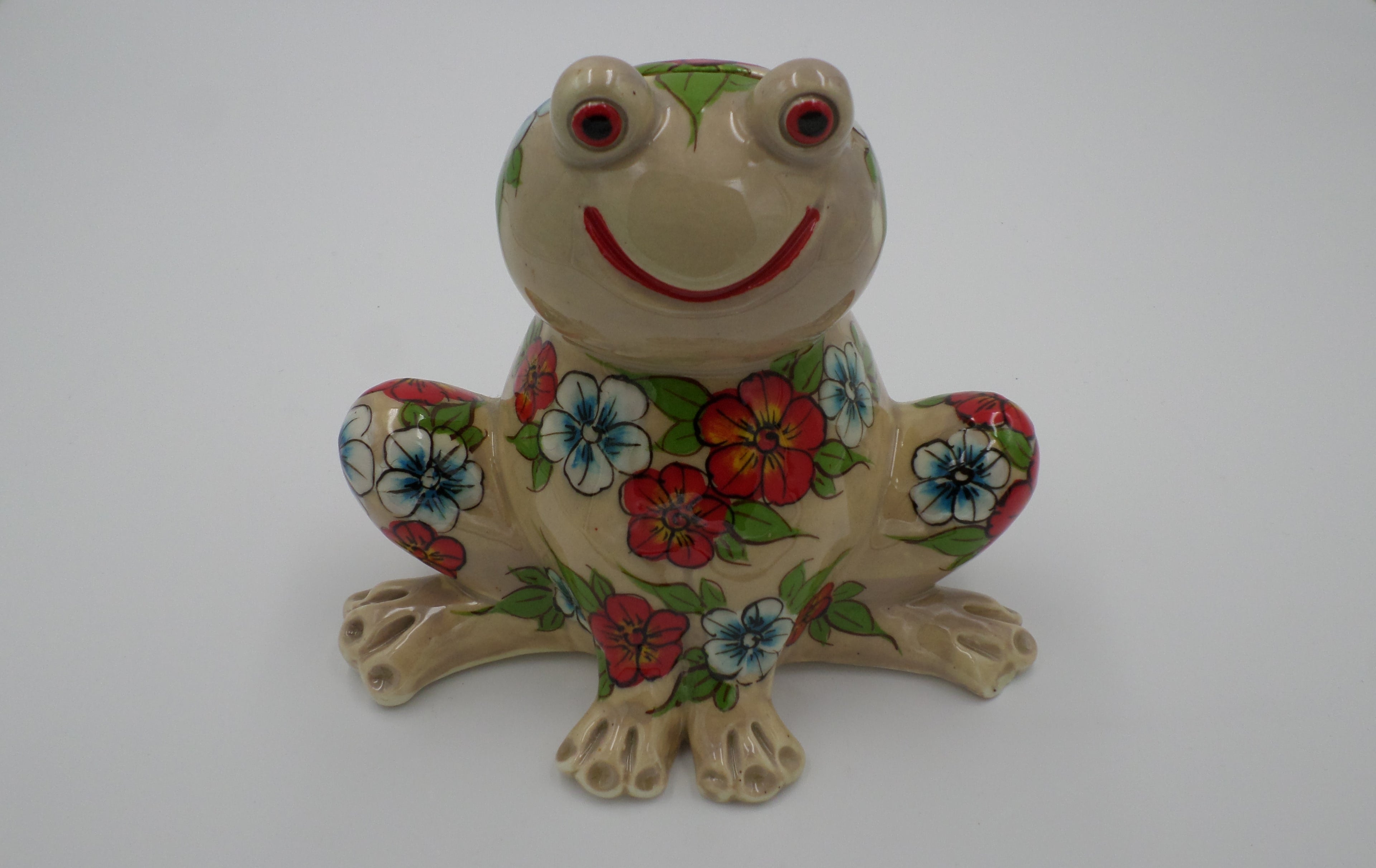Tirelire grenouille aux pensés couleur crème en ceramique