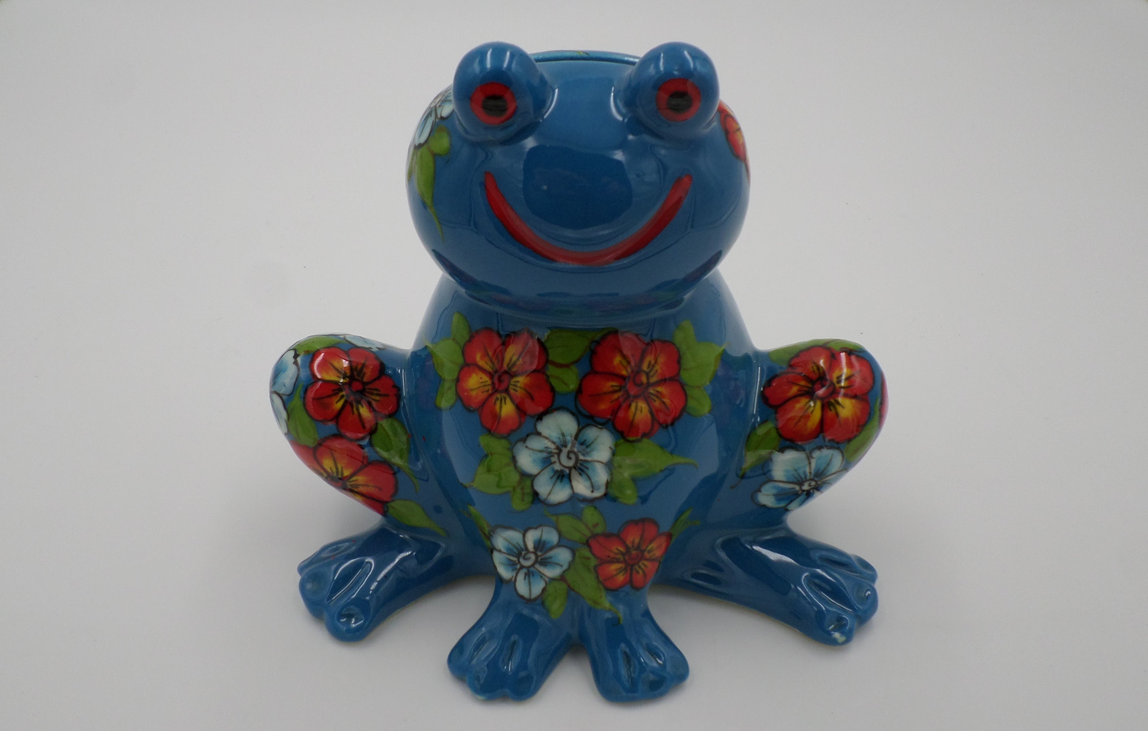 Tirelire grenouille aux pensés couleur bleu en ceramique