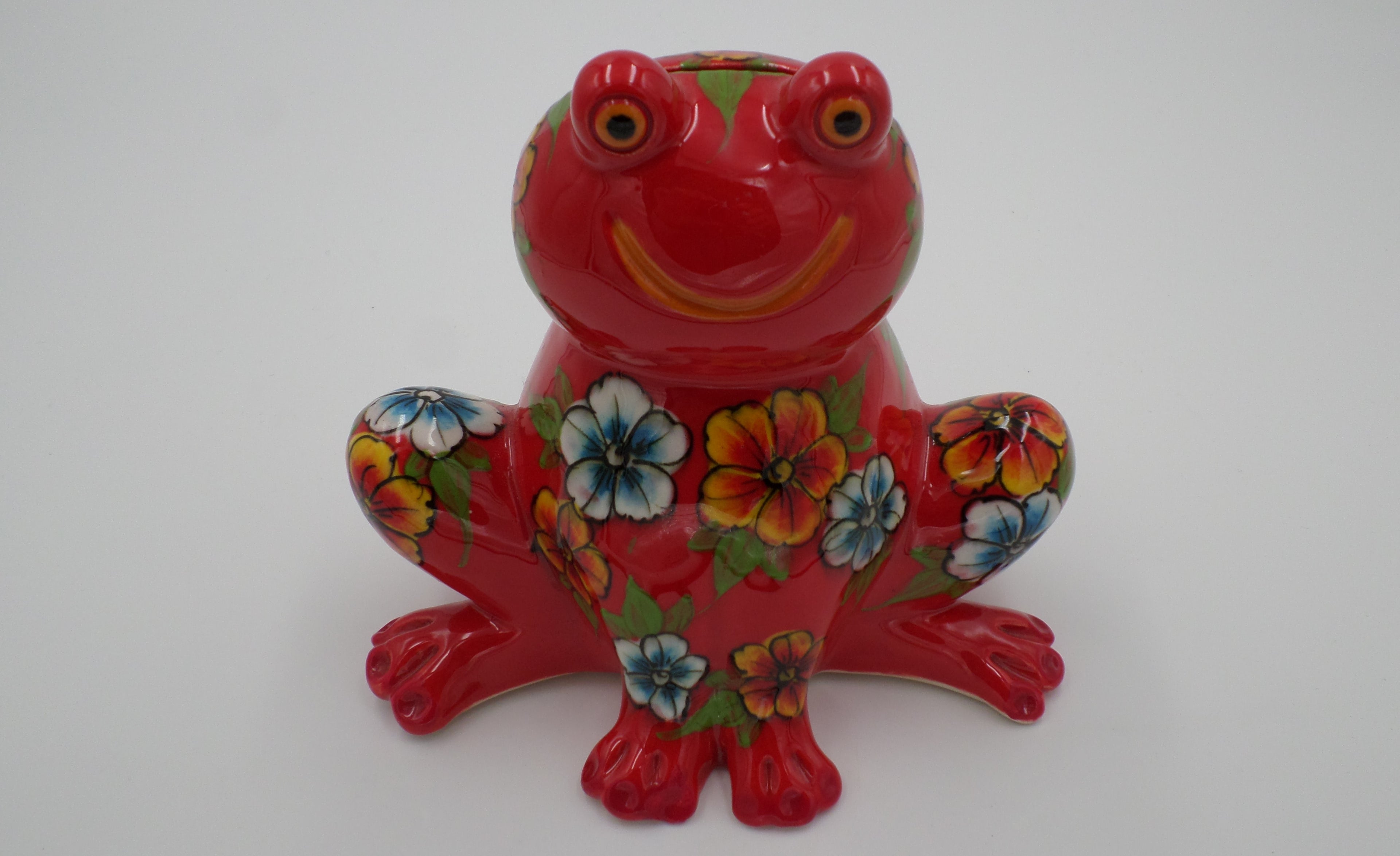 Tirelire grenouille aux pensés couleur rouge en ceramique