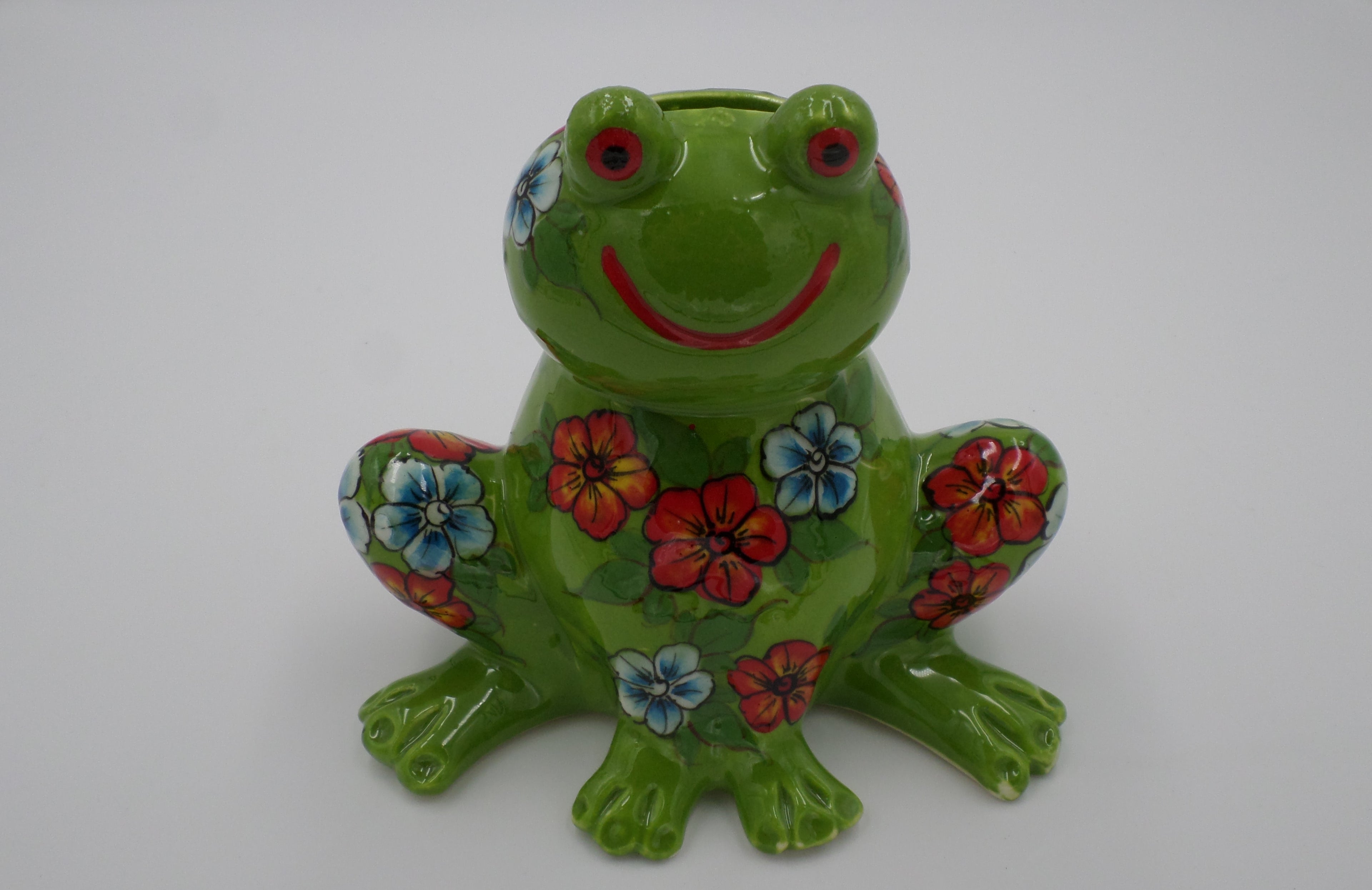 Tirelire grenouille aux pensés couleur verte en céramique